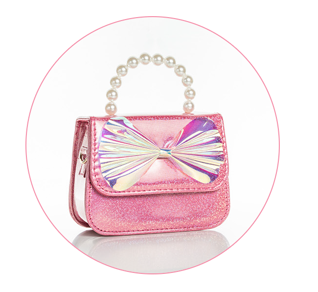 Sparkly pink handbag with a pearlescent bow on the front flap