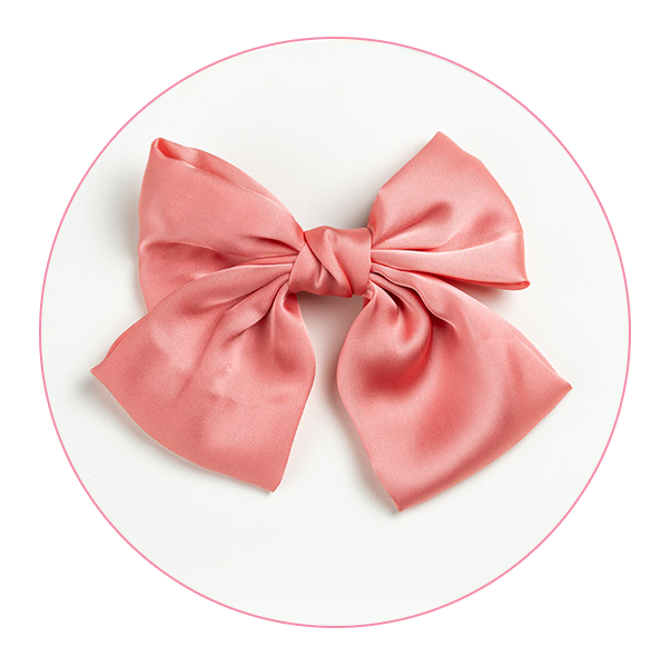 A large pink satin bow accessory