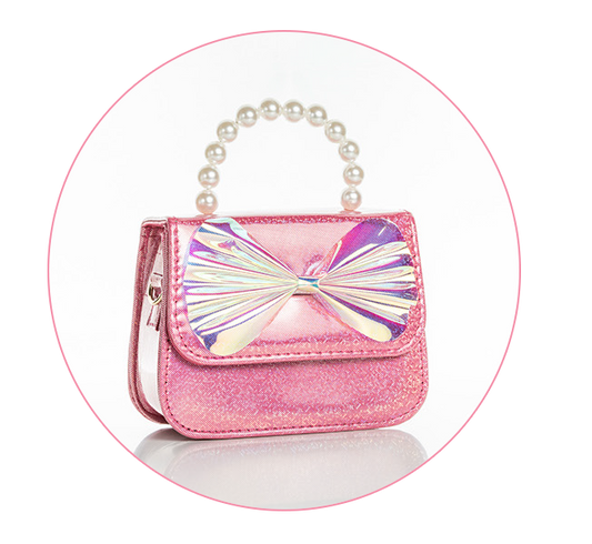 Sparkly pink handbag with a pearlescent bow on the front flap