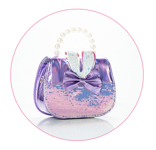 A small, stylish handbag with a purple and pink color scheme.