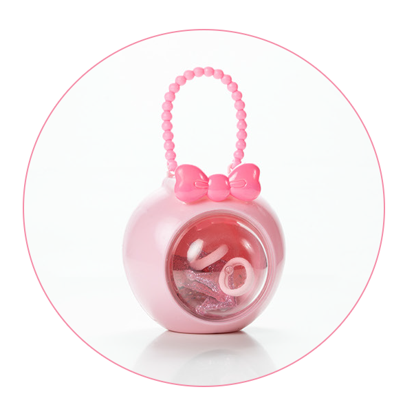 A round pink accessory case with a beaded handle