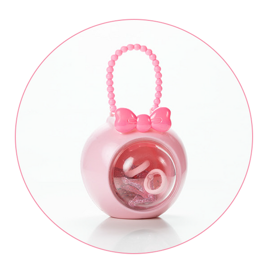 A round pink accessory case with a beaded handle