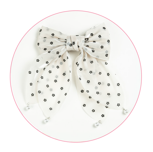 Decorative hair bow accessory featuring a delicate and charming design